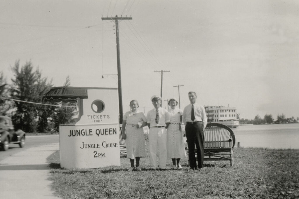 Historic photo of owners family in front of Jungle Queen Box Office