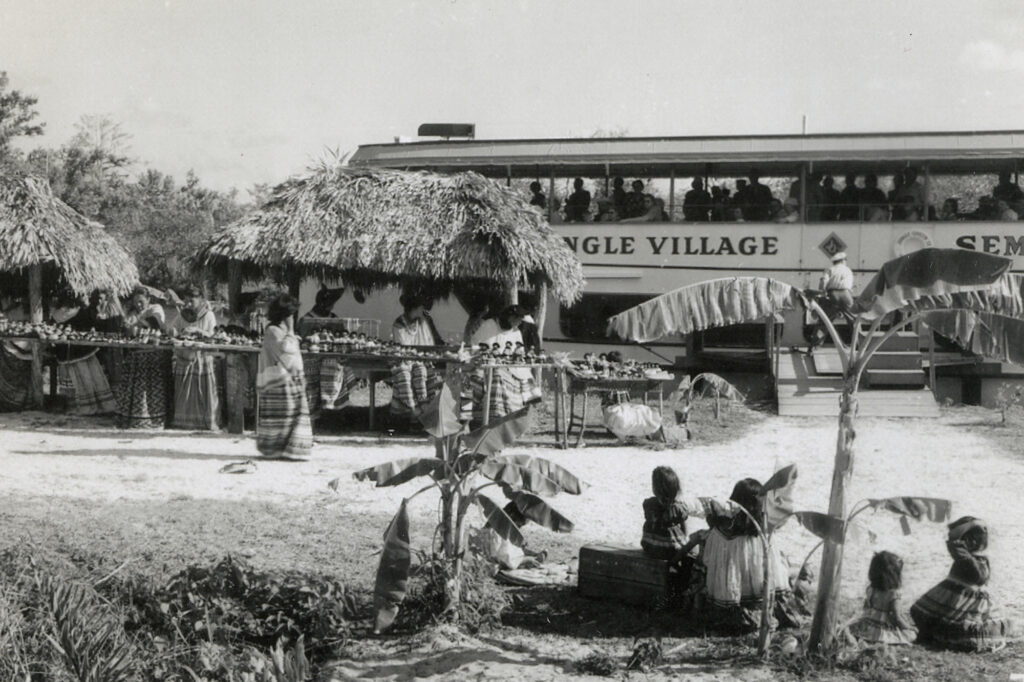 Historic photo of Seminole Tribe Trading Post with Jungle Queen in background